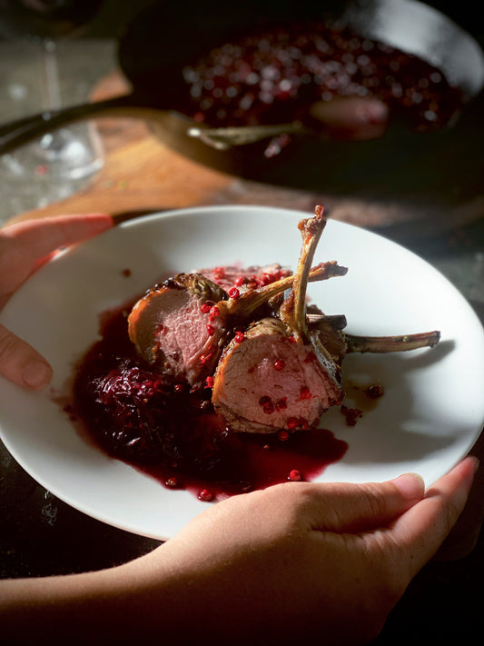 ROSEMARY SEARED LAMB RACK WITH ĀREPA CARAMELIZED SHALLOTS & PINK PEPPERCORNS